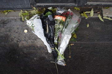 Flowers left on pavement to mark the memory of victims of November 13, 2015, terror attack - Bataclan, Boulevard Voltaire, 75011, Paris