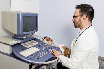 Fototapeta na wymiar Doctor doing medical examination of patient with ultra sound