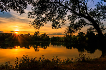 Obraz premium Ricklinger Kiesteiche zum Sonnenuntergang