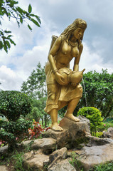 Fototapeta na wymiar Golden woman in the park in Vietnam 