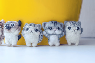 Obraz premium Felting toy little kittens with glasses