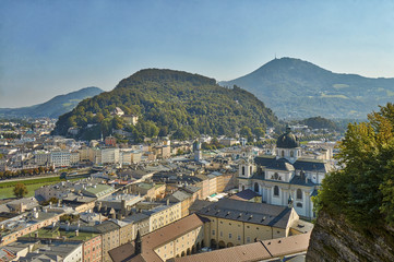 Fototapeta na wymiar HDR beautiful landscape view of the city of Salzburg in Austria with a cathedral and mountains in the background.