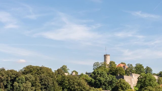 Establishing time lapse shot of the iconic Sparrenburg, the castle dominating the German city of Bielefeld