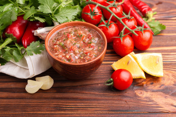 Traditional mexican red spicy sauce salsa with ingredients
