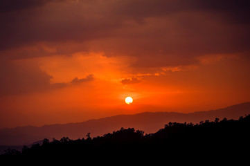 Beautiful sun silhouette at sunset mountain village in Chiang Mai