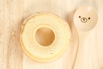 Baumkuchen. top view. German layer cake on the wooden background. Baumkuchen cake is also famous in Japan because it symbolizes the longevity life with its layers and roundness