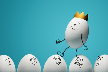 Concept of ambitiousness, careerism. An egg with golden crown walks through heads the white eggs.