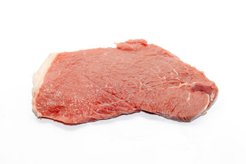 close up of beef top side on white background