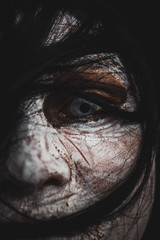 Women monster face and focused eye close up.