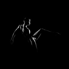 Fototapeta na wymiar Black and white silhouette of male ballet dancer.