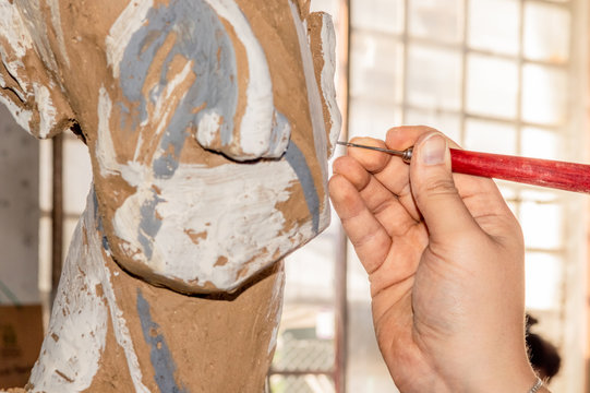 Woman working on a sculpture