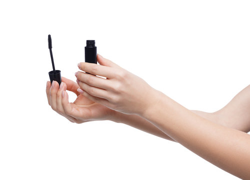 Woman Hands Holding Mascara On White Background