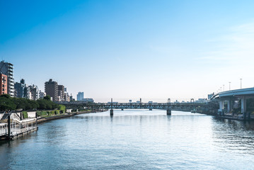 TOKYO, JAPAN - June 22, 2018: Tokyo Railway bridge and blue sky.