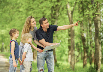 Fototapeta premium Happy family having a rest outdoor in the autumn park.