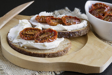 sun-dried tomatoes with soft cheese. Italian appetizer.