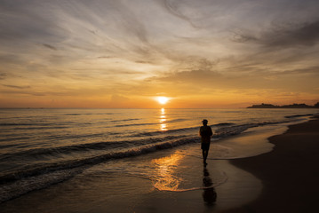 The fisherman stood anticipation by the sea in the morning, at sunrise, Songkhla province, Thailand country