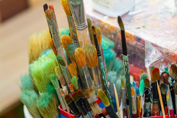 Fototapeta premium A lot of painting brushes in the boxes. Closeup, selective focus