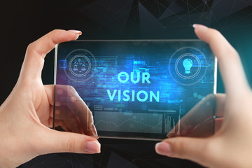 The concept of business, technology, the Internet and the network. A young entrepreneur working on a virtual screen of the future and sees the inscription: Our vision