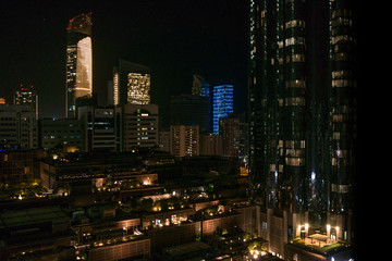 Fototapeta na wymiar Abu Dhabi city towers and skyline at night - World trade center and the mall
