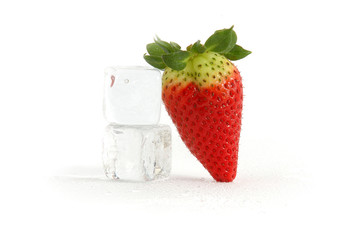Fresh red strawberry with ice cubes - isolated