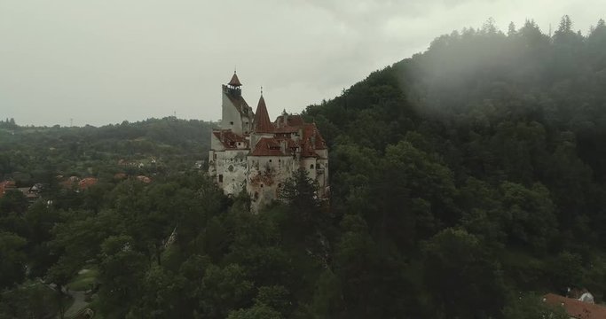 Aerial view of a castle on a rainy weather with overcast sky. 