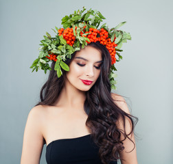 Naklejka premium Smiling woman with healthy skin, wavy hair and makeup