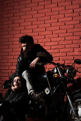 Fototapeta na wymiar born to ride. biker couple born to ride. bearded man and sexy woman born to ride. born to ride on motorbike