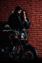 Fototapeta na wymiar leather fashion. fashion couple in leather jacket. leather fashion for biker couple. leather fashion concept. being a biker.