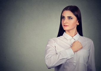 Self confident young woman looking away with pride