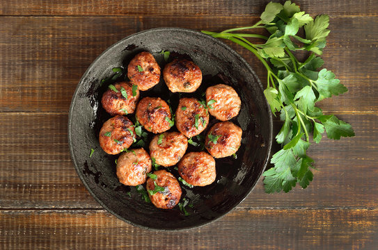 Fried meatballs and fresh parsley