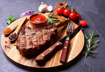Tomahawk steak with spices and vegetables