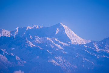 Plakat Himalaya mountains in Nepal, view of small village Braga on Annapurna circuit at sunset or sunrise
