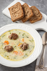 Creamy vegetable soup with beef meatballs.