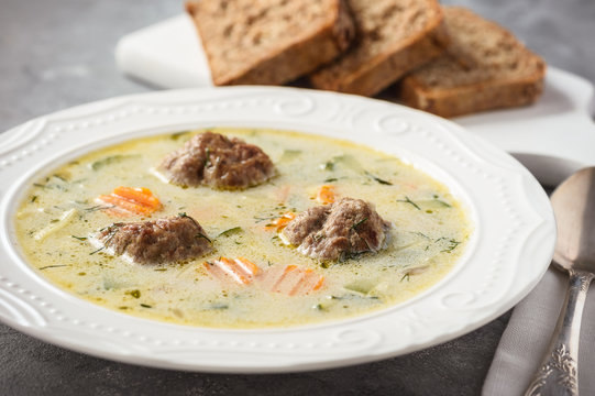 Creamy vegetable soup with beef meatballs.