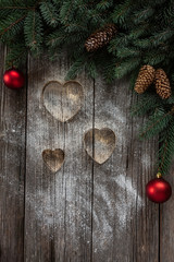 Christmas  background with fir tree branches, cones, Christmas decorations. Christmas and New Year concept. Close-up, top view on vintage wooden table, place for your text