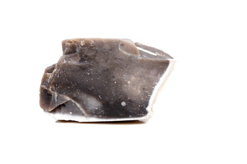 Macro mineral stone Flint in the rock on a white background