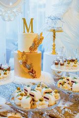 Banquet table with sweets and cake. 