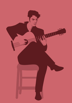 Spanish guitarist playing flamenco sitting on a chair