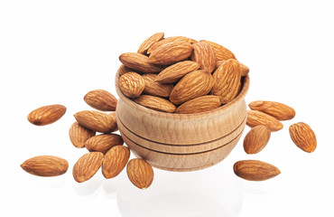 Almond nut in a wooden bowl isolated on a white background