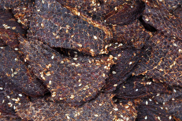dried beef slices in spices with sesame seeds
