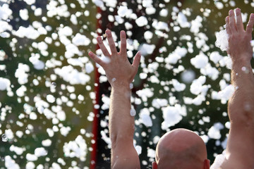 raised by human hands in the suds at the concert