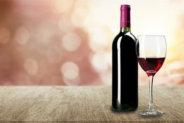 Red wine glass on desk
