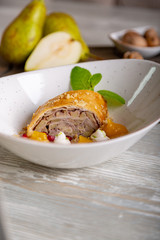 Close up view of beautiful elegant sweet dessert served on the plate. Beautiful decoration, restaurant dish, ready to eat. Tea time, cozy atmosphere.