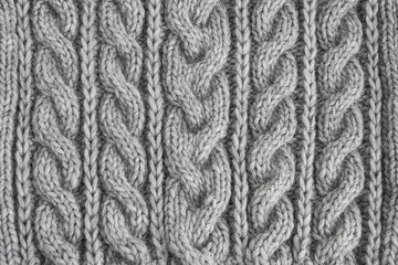 Gray knitted texture. Handmade Knitwear. Background