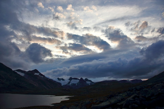 Juicy sunset on the background of Mountain lakes. Jotunheimen National Park. Norway