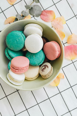 Composition of delicious macaroons in round gift box, sweet dessert