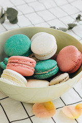 Composition of delicious macaroons in round gift box, sweet dessert