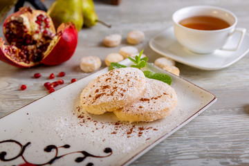 Close up view of beautiful elegant sweet dessert served on the plate. Beautiful decoration, restaurant dish, ready to eat. Tea time, cozy atmosphere.