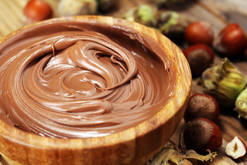 Homemade hazelnut spread in wooden bowl. Hazelnut Nougat cream