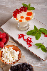 Close up view of beautiful elegant sweet dessert served on the plate. Beautiful decoration, restaurant dish, ready to eat. Tea time, cozy atmosphere.